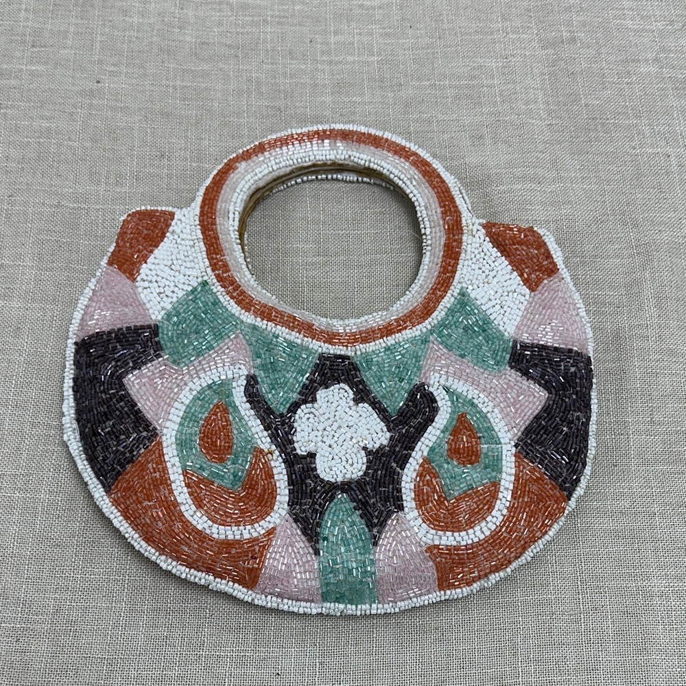 Elegant Beaded Handbag - Multicolor
Some tiny stains